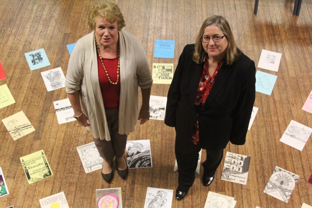Deputy Head of Academy Rachel Boyce with Kath Philpott and some of the programmes. Can you helps find the missing Fairfax School Eisteddfod programmes?