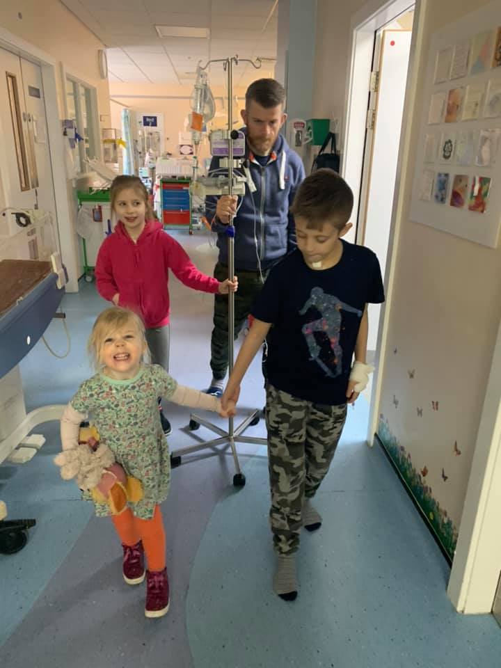 Elijah with dad Martin and sisters Matilda and Beatrice.