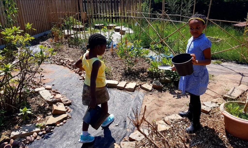 Pupils get stuck in building the garden at Brookvale School's Joshua's Corner .