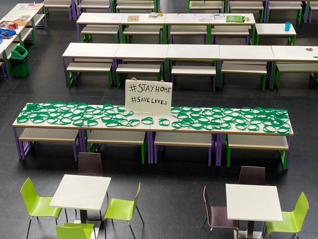 A table at Plantsbrook School covered in parts for NHS face visors that have been made by staff.