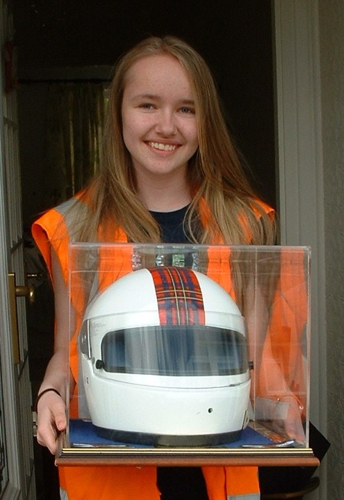 Charlotte with the trophy, which is a crash helmet that belonged to motorsport star David Leslie who died in 2008.