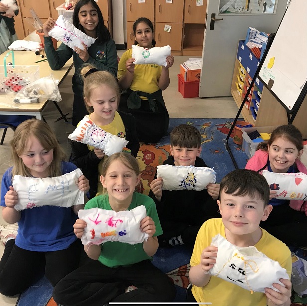 Children in Year 3 and 4 happy with their pillows made in craft club with Mrs Dilworth.
