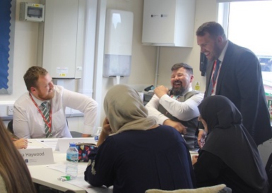 School standards minister Jonathan Gullis, who until recently was a teacher at Fairfax Academy in Sutton Coldfield, talks to teachers taking part in training at the North Birmingham Teaching School Hub at Arthur Terry.