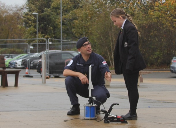 Navy visit Stockland Green School: Up, up and away! Getting ready to launch one of the paper flares in the playground.