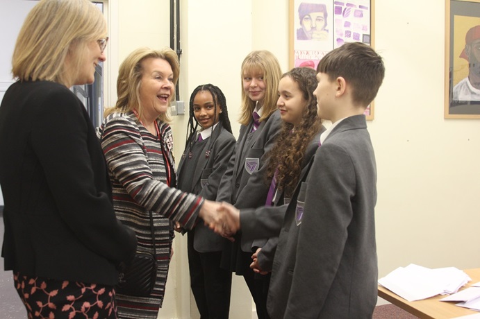 Deputy Lieutenant of the West Midlands Dawn Ward CBE greets John Willmott students.