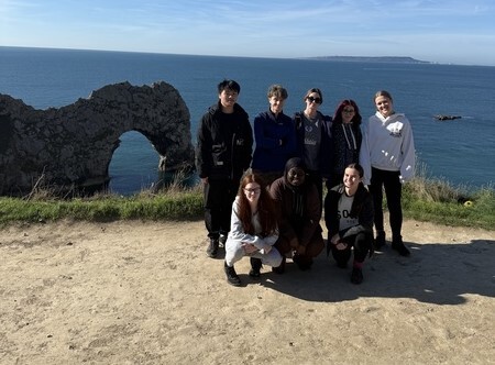 Geography students visiting the iconic Durdle Door in Dorset.