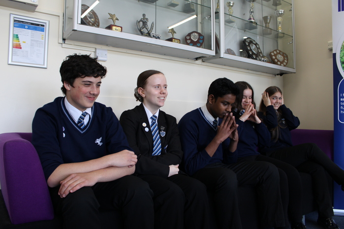 The candidates nervously await the result.